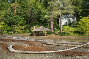 From the water, the setting reveals the privacy, presence, and rarity of this high-end Cooper Point waterfront home.