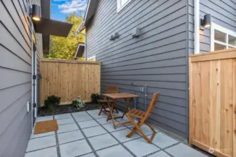 Cozy, ground level patio has direct access to parking with EV ready charging.