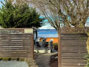 Gate door is open showing the deck to enjoy the view & relax.