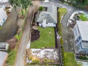 Aerial photo of property looking eastward to Austin Road NE.  On the far westside(bottom of the photo) of the backyard is where the seller had a chicken coop and fenced area for the chickens could roam.