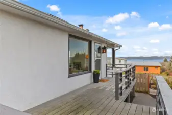 Deck area which is the main door to enter the home.