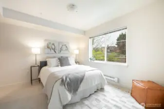 Primary bedroom easily fits a queenn bed!