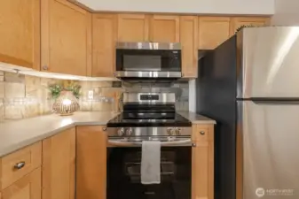 Brand new stove, microwave, and refrigerator