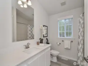 Updated full bathroom servicing the other 2 bedroom.