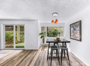 Charming dining area with views of the garden space and patio.
