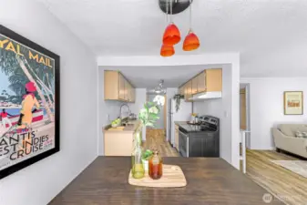 On the backside of the kitchen is another hallway with two additional closets and the guest bathroom.