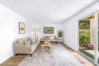 This unit is unique in that is has a larger patio and room for gardening and plants. The large slider allows for an abundance of light to flood in.