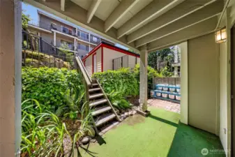 Your private oasis! There is room to garden (vegetables are growing in the white containers). With plenty of space for a table and chairs you can enjoy dining outside.