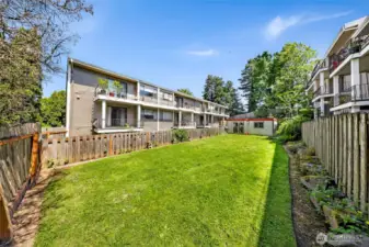 The private lawn is fully fenced and is adjacent to the laundry building.