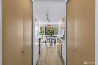 A pantry is located on the left. The new water heater is in the closet on the right.