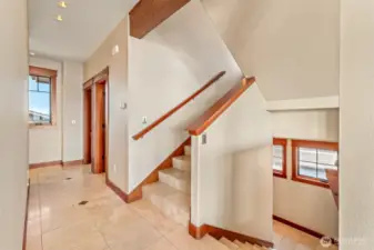 Main Level Hallway: Up to Owner's Suite, down to lower level