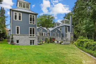back exterior of 2-story home with daylight basement