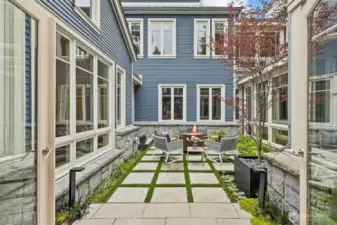 courtyard with fire pit and entertaining space off of dining room
