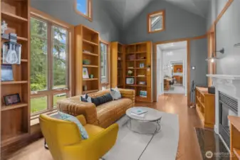 Library room with gas fireplace and built in solid wood shelving