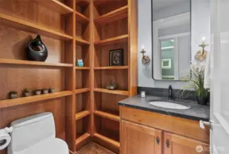 half bath on main level with built in solid wood shelving
