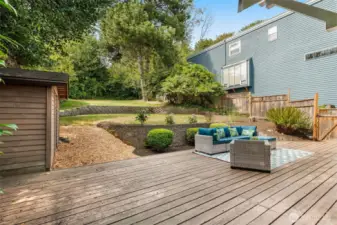 Expansive deck and green space in backyard