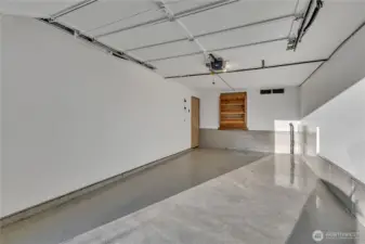 The garage is a WOW!  Clean as a whistle with showroom quality floor finish.  NOTE what looks like wood shelving??  Well, it IS NOT!