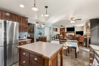 The kitchen opens to the secondary dining and living room.