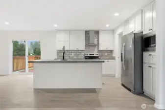 All stainless steel appliances stay.