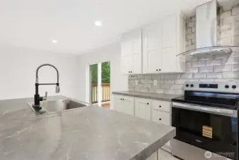 Looking towards dining space and sliding glass door that looks over your large back yard.