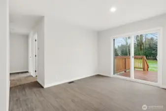 Dining area. The hallway leads to 2 of the bedrooms and a den.