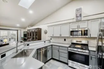 Newer spacious kitchen w/ quartz countertops, walk in pantry and a lot of storage room! Houses fixtures and lights are all new.