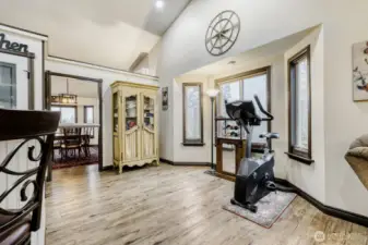 Family room with vaulted ceilings and a lot of natural light.
