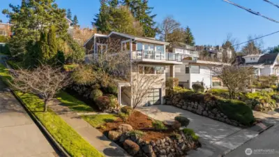Home sits up high on a quiet corner lot offering privacy and views.