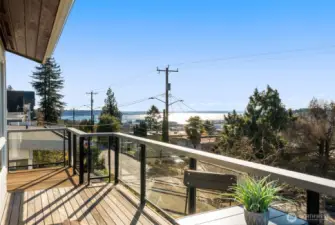 Step onto the west-facing deck for sunset views, or head to the back deck—perfect for BBQs, outdoor movie nights, and easy evenings with friends.