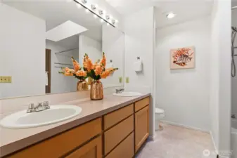 A generous primary suite with a double vanity ensuite featuring a soaking tub.