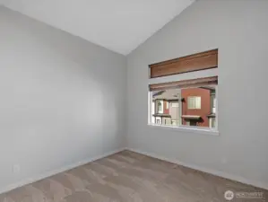 2nd upstairs bedroom with vaulted ceilings.