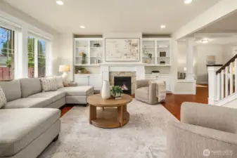 Spacious family room (fire added for visual effect, buyer to verify functionality).