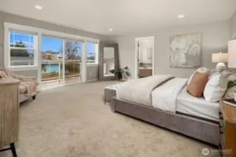 Primary bedroom with private balcony & ensuite.