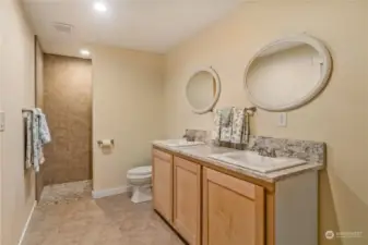 This is your Primary Bathroom and to the right of the sink is a large area. plumbed for a tub (if you want another one)