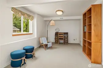 With this lovely built-in bookcase, this area on the lower level might inspire an office or media room.