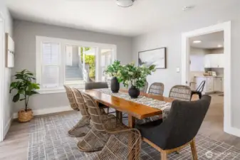 Easily accommodates a 10–12 person dining table, formal sitting area, and side buffets for entertaining at scale