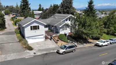 Corner-lot accessory home offers dual access from both the main and side streets, opening onto a private courtyard