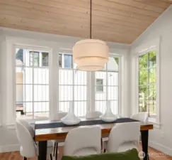 Dining space is roomy and comfortably accommodates a large family dinner.