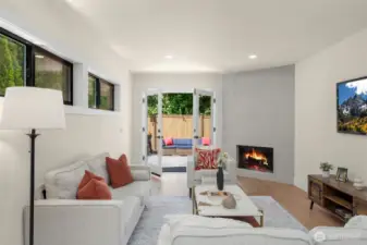 Sunken living room was by design. Cleverly crafted and gives depth to the space.
