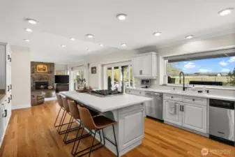 Ample seating at the island as well as room for a small eat-in kitchen table between the family room.
