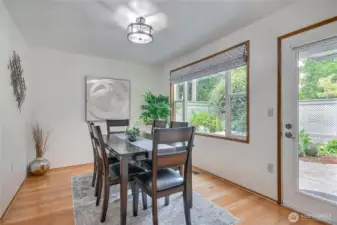Dining with door to spacious patio and convenient door to your garage.
