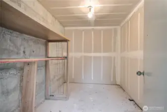 Large 8'x10' storage room located across from front door.