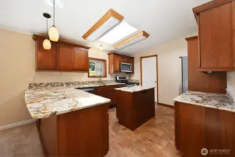 Solid cherry cabinets, granite counters, and stainless steel appliances