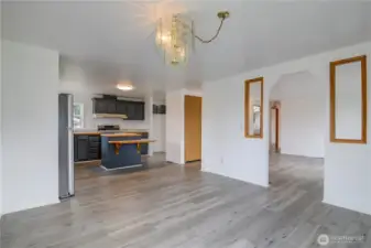 Open concept Living. From Dining Room view of Living Room and updated Kitchen.