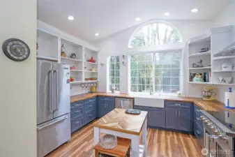 Featuring new cabinets, stainless steel appliances, and elegant butcher block counters.