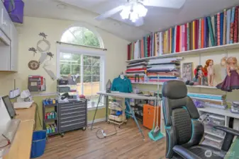 Den/office currently set up as a craft room, offering plenty of workspace.