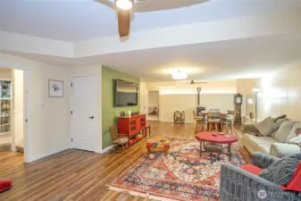 Generous family room featuring a cozy pellet stove and space for a game table.