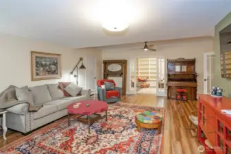 Another view of the family room looking into the extra finished room behind the glass pocket doors.