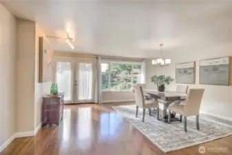 French doors lead to the peaceful backyard