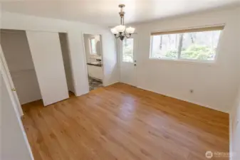 Primary bedroom with full en suite bathroom and door to the backyard